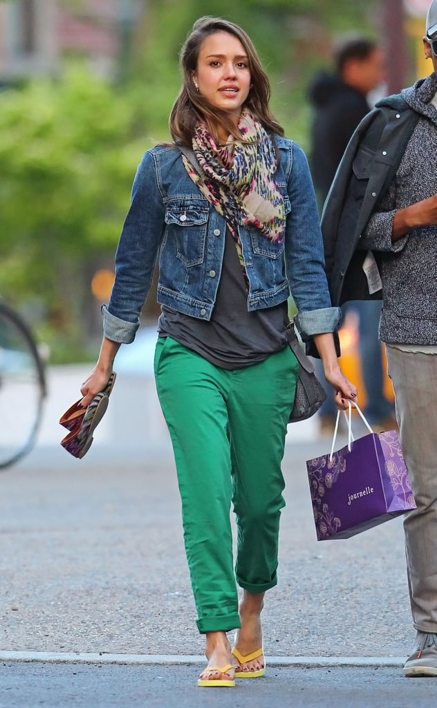 For a pedicure session in NYC, Alba swapped her colored denim for a classic jean jacket, preppy green pants, and a printed wrap scarf.