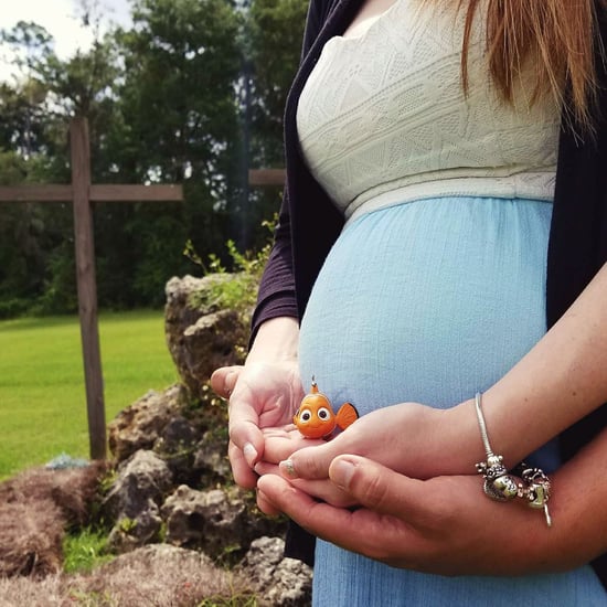 Pregnant Woman Posing With Finding Nemo Figurine