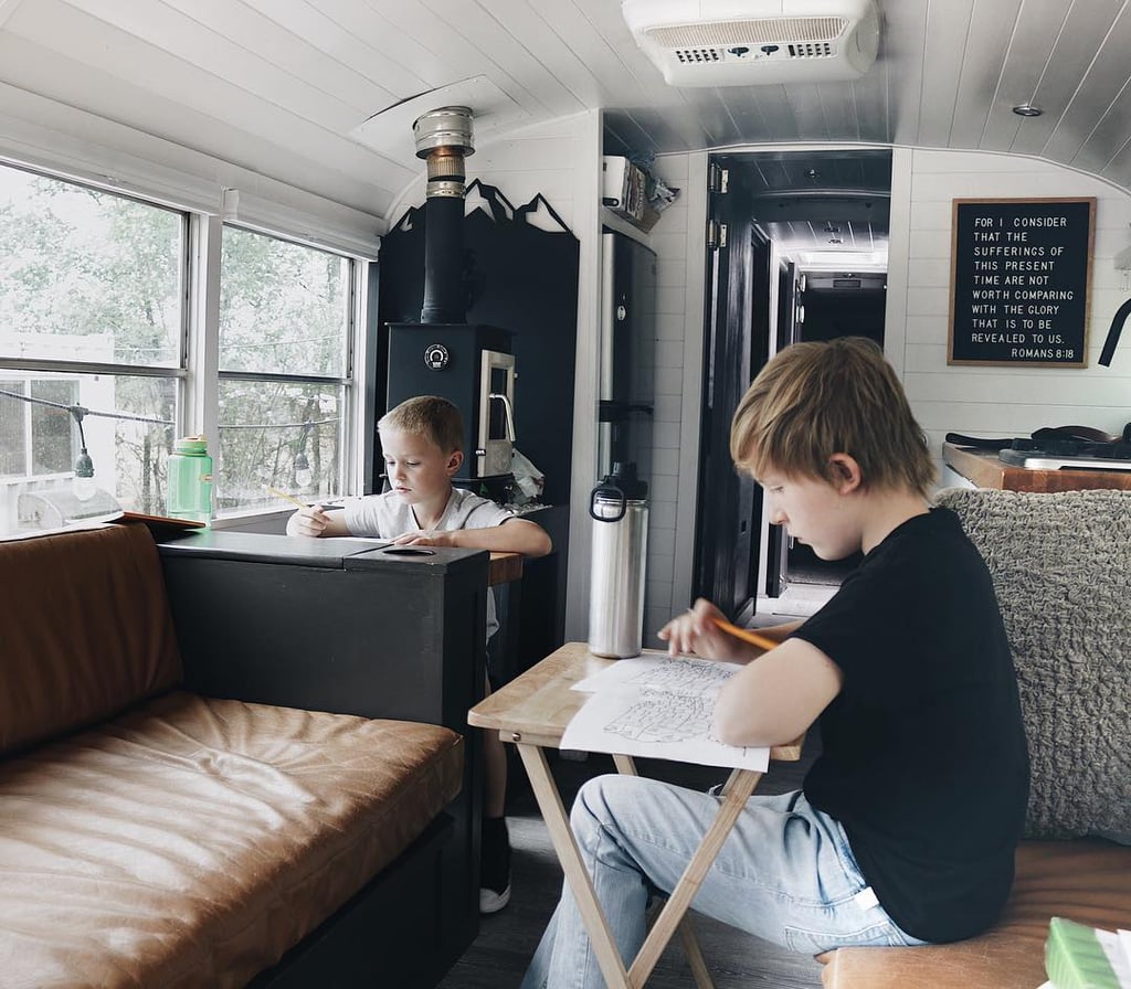The Kids Use the Table Space For Homework
