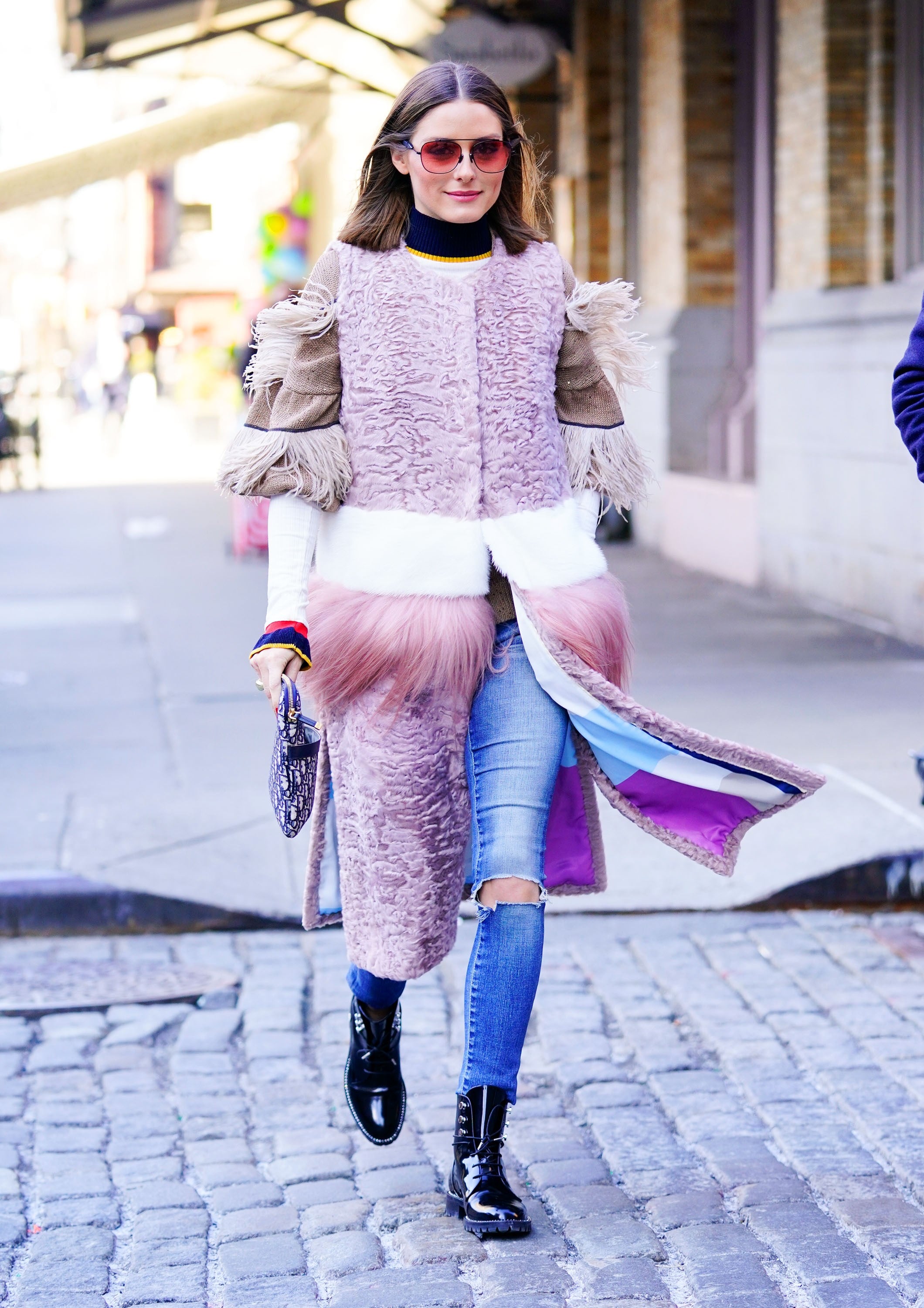 Olivia Palermo in fur coat with purple bag and white sneakers in New York  on April 11 ~ I want her style - What celebrities wore and where to buy it.  Celebrity Style
