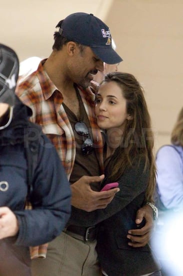 Pictures of Rick Fox and Eliza Dushku at LAX During the Holidays