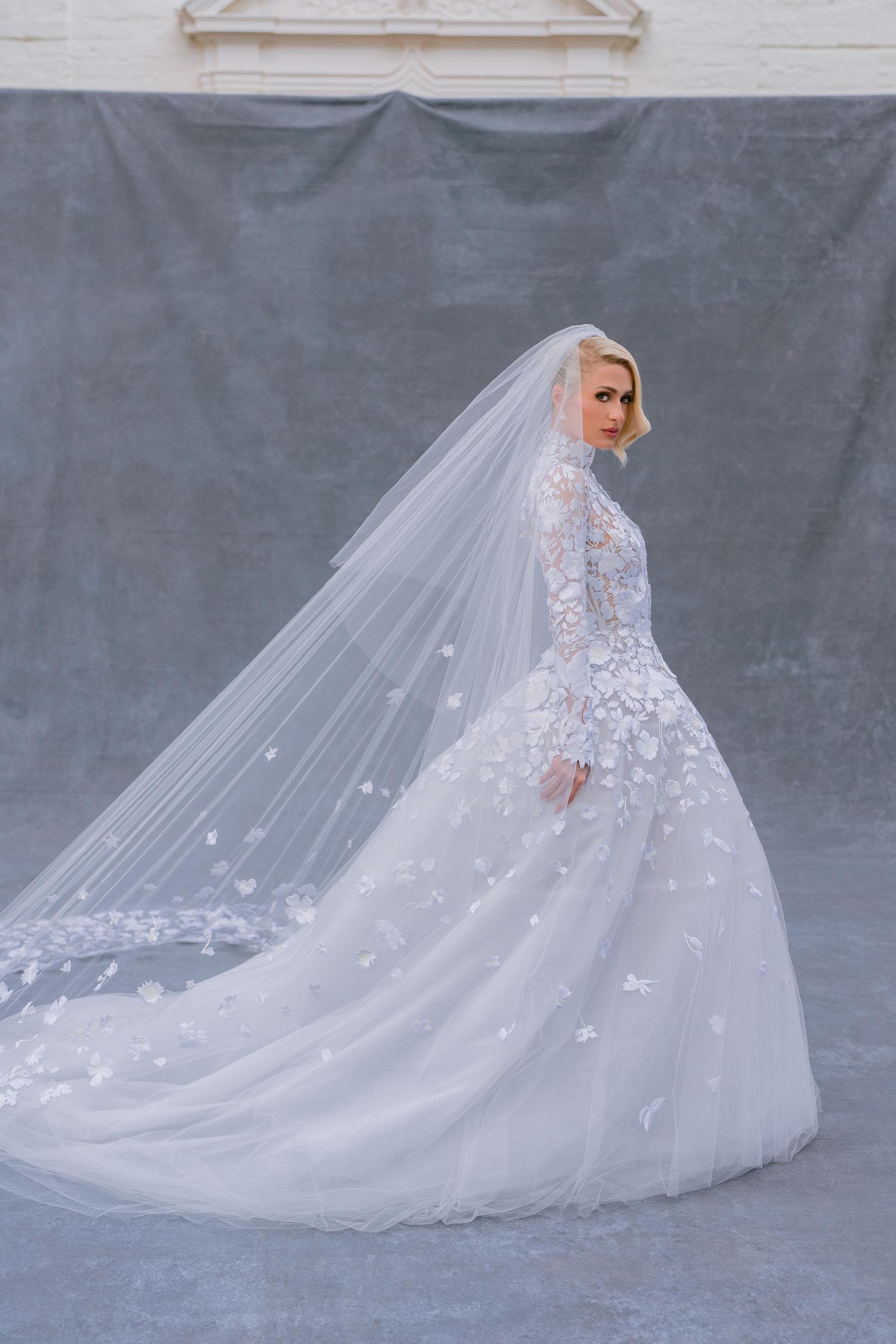 See Paris Hilton's wedding dress and three reception looks