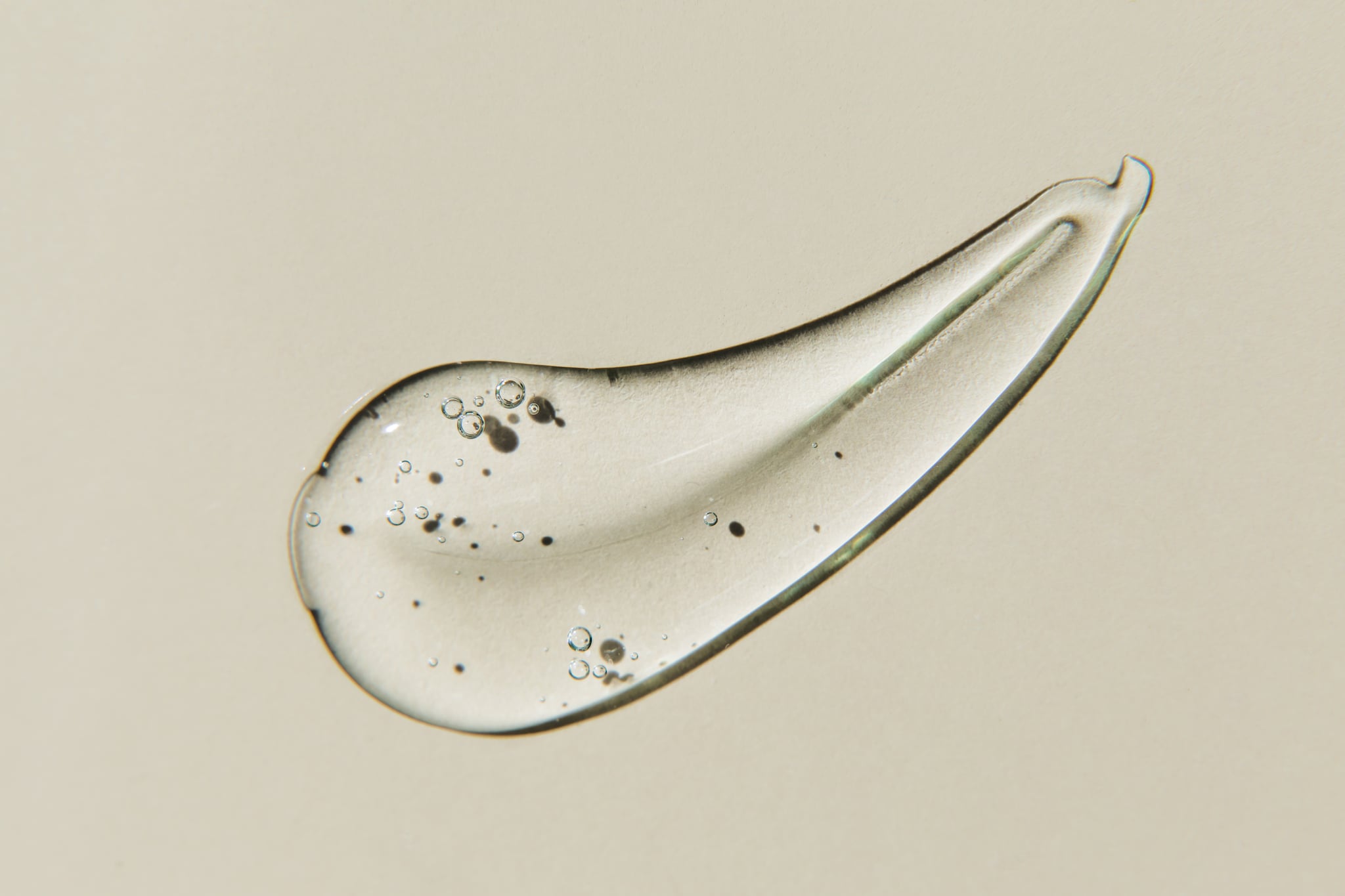 transparent smear of gel on beige background