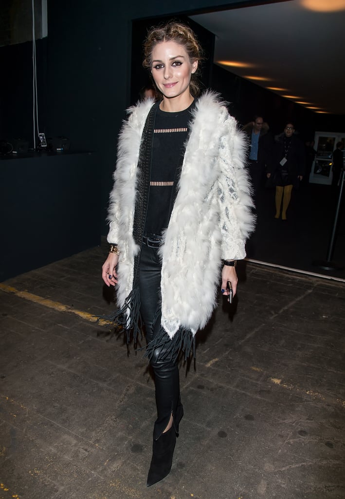 For the Marchesa show, Olivia balanced a sheer-inset black top and leather pants against a luxe white coat.