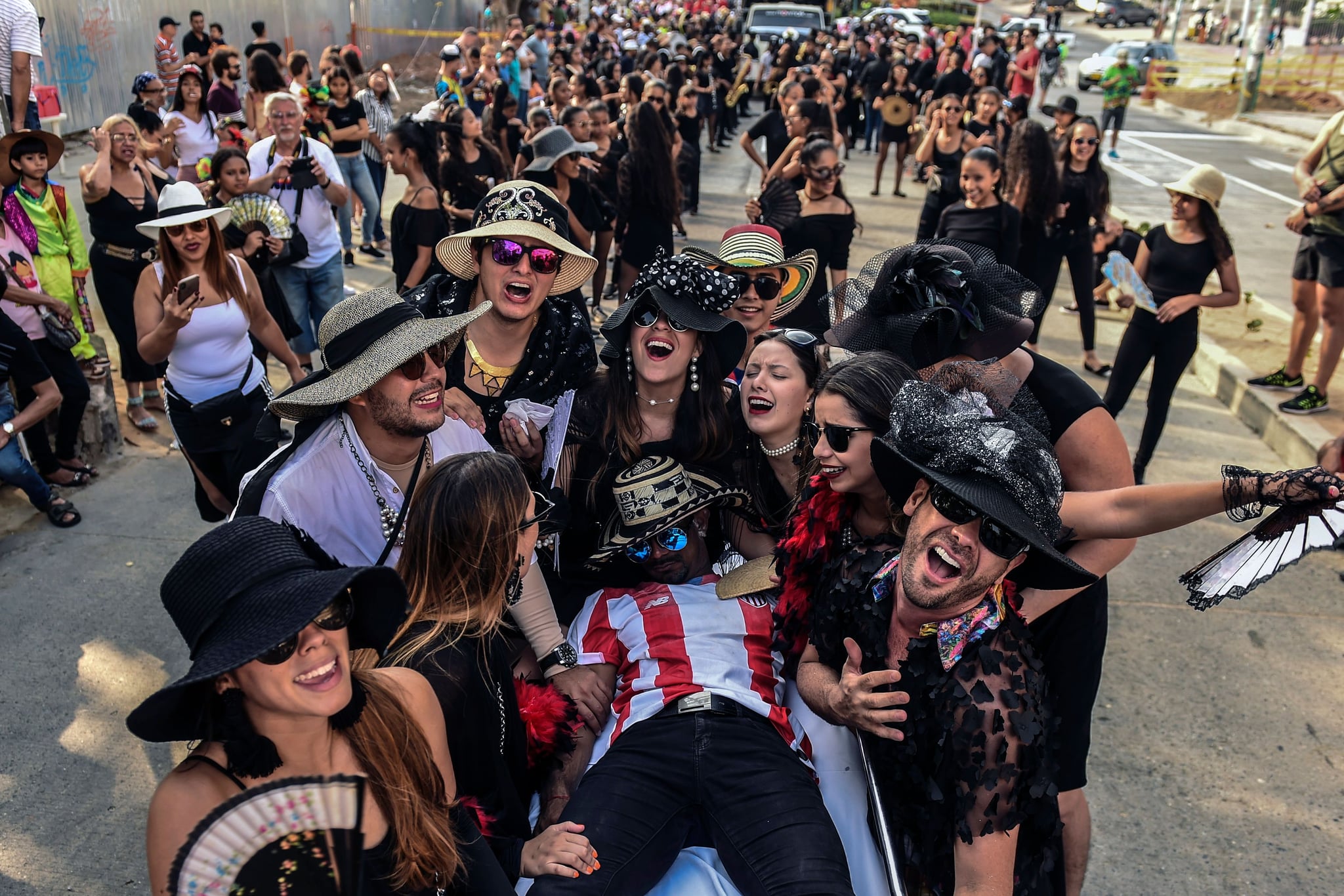 Revelers perform during 