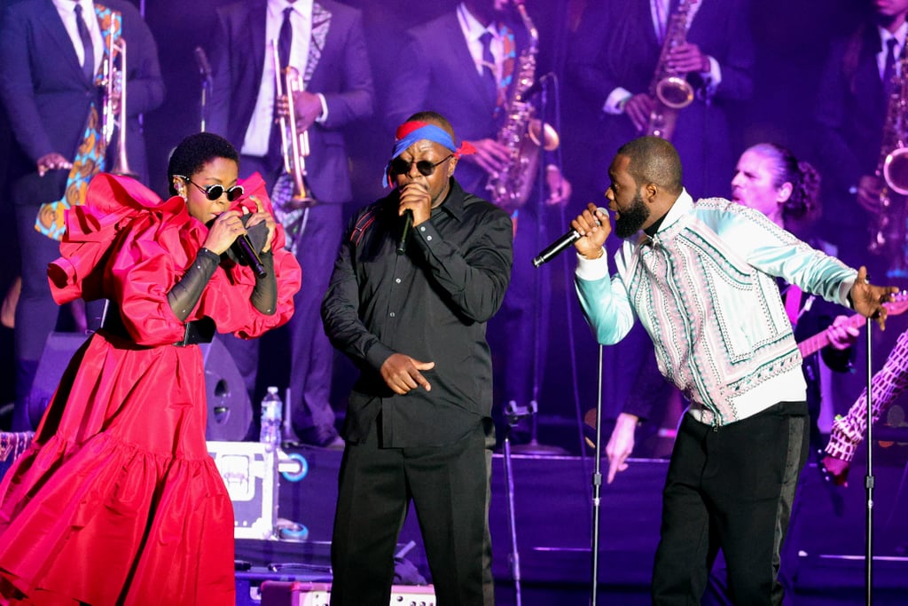 The Fugees' reunion tour has officially commenced! On Wednesday, Lauryn Hill, Wyclef Jean, and Pras Michel performed their first show in 15 years at a pop-up event in NYC. The concert was hosted in partnership with Global Citizen and Live Nation and served as the soft launch of their reunion tour, which officially kicks off in November. According to Rolling Stone, the group performed for about 45 minutes, singing hits like "Ready or Not," "Zealots," and "Killing Me Softly With His Song." They also regarded the mini concert as a preview of what's to come for their tour. No official videos of their performance have been released yet, but you can see a handful of photos from their concert ahead.