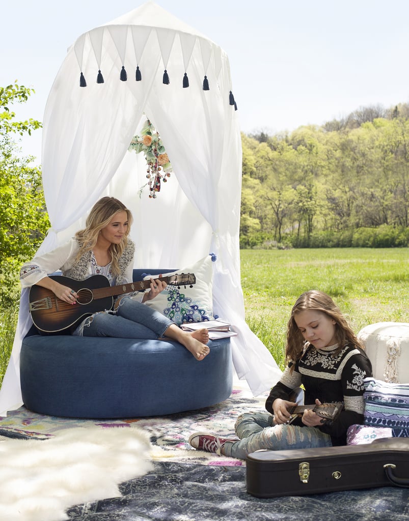 POPSUGAR Moms: Where did you each collect your inspiration for the collection from?
Lennon and Maisy: For the most part, we both did a lot of Google imaging and searched different feelings that related to a bohemian style. We used Pinterest to create inspiration boards and then worked with the PBteen designers to create all the different patterns, colors, and styles we loved.
Products pictured: Nashville Lounger ($999),  Indigo Printed Overdye Rug ($169-$699), Free Spirit Canopy ($199), Moroccan Vanity Stool ($259), Embroidered Peacock Pillow Cover ($45)