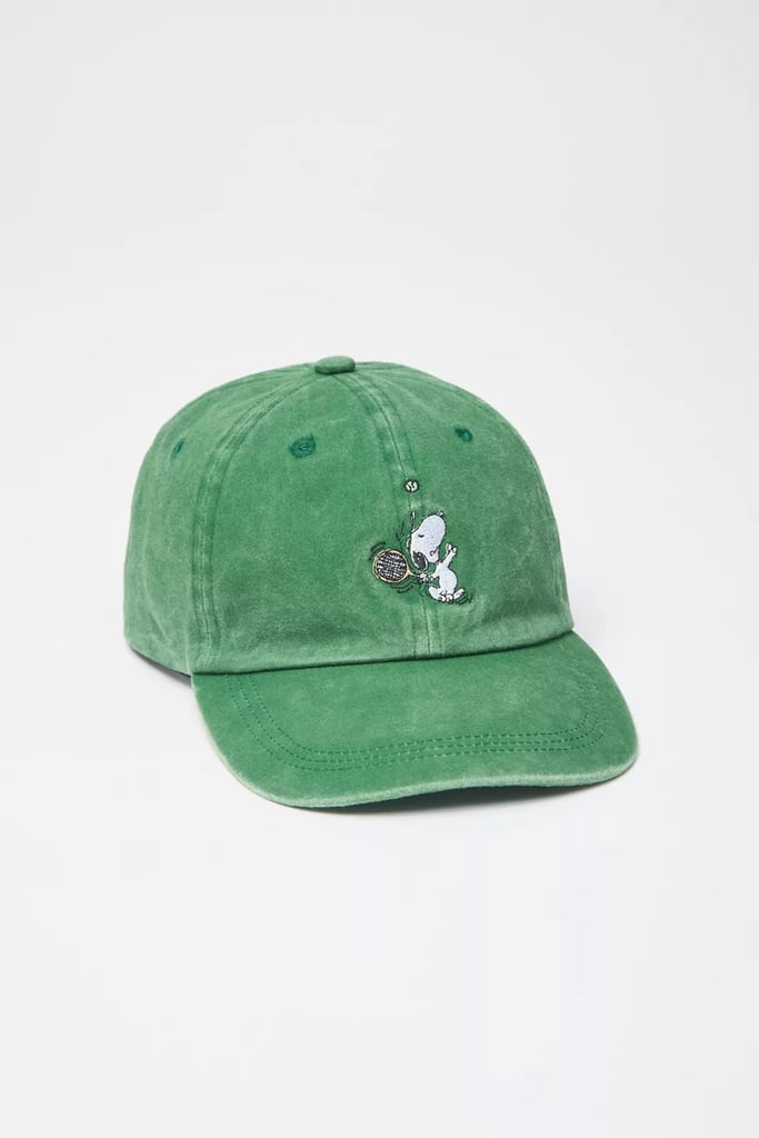 Urban Outfitters Snoopy Tennis Washed Dad Hat ($30)
This dad hat offers a more nostalgic take on tennis fashion and features a cute Snoopy print on the front of the accessory. Wear it with a vest tank, tennis skirt, and athletic shoes for your next match; it'll help to complete any tennis outfit with a bit more character and keep your face protected from the sun.