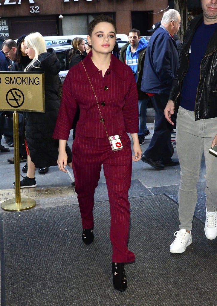 In New York wearing a striped red set and black boots.