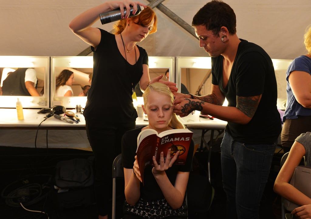This Model Got Her Hair Done Backstage While She Read The Portuguese