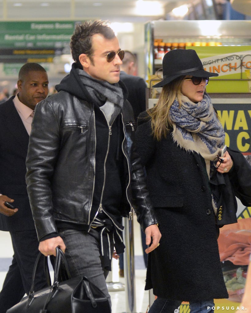 Jennifer Aniston and Justin Theroux stayed close after landing at JFK on Friday.