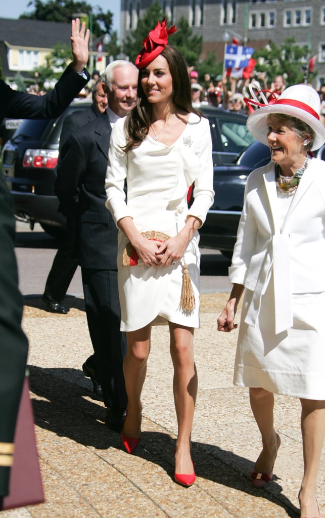 Kate's white, ruffle-finished dress from Reiss made for her most memorable outfit. She added a touch of red with a Sylvia Fletcher for Lock & Co. fascinator and woven Anya Hindmarch clutch — a fashion-girl favorite. 
