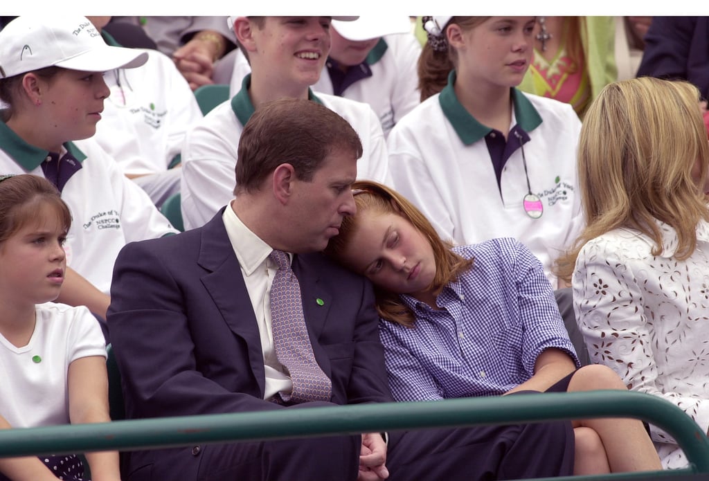 A tired Beatrice rested her head on her dad's shoulder during a charity tennis tournament in 2000.