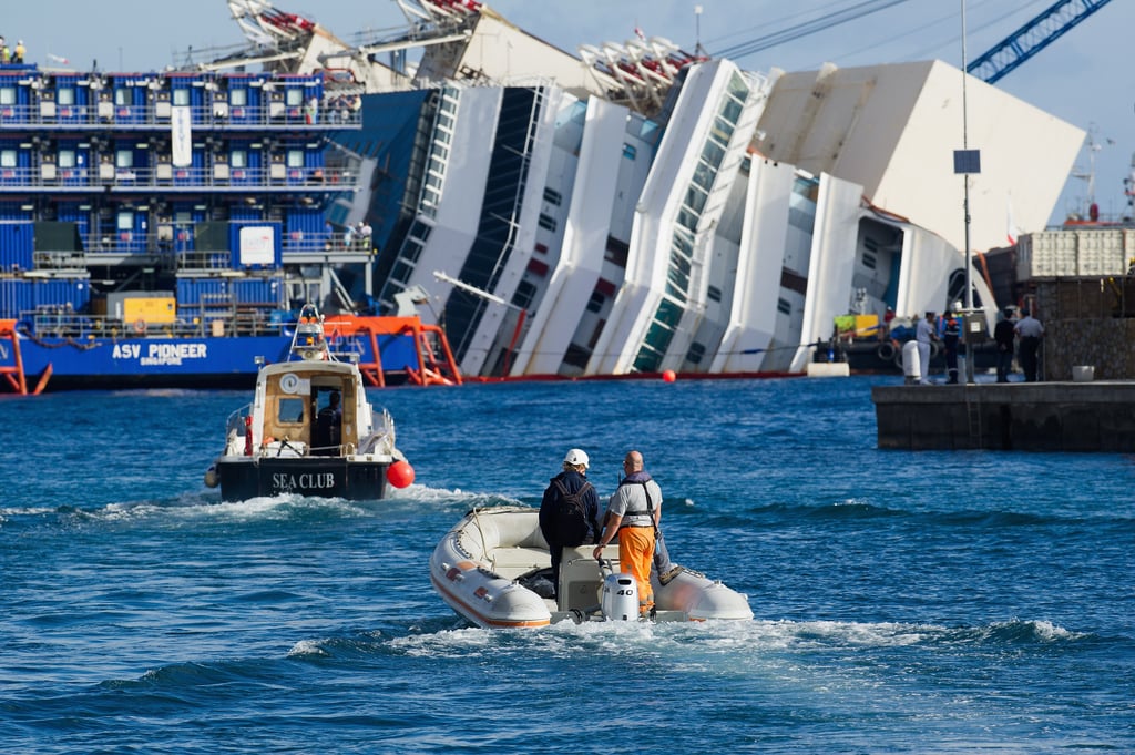 Engineers rode boats over to the Costa Concordia to begin the project.