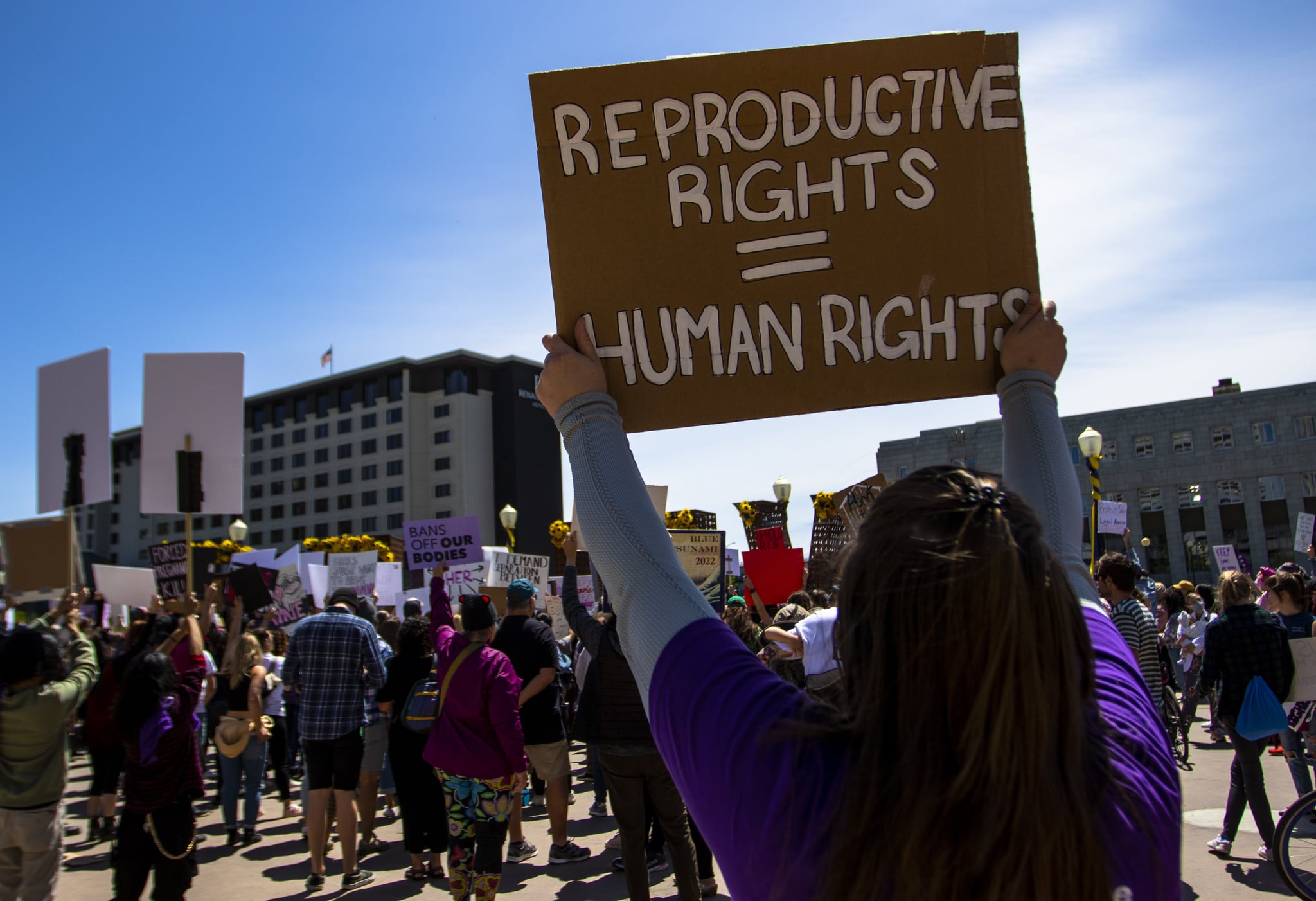 RENO, NEVADA, UNITED STATES - 2022/05/07: A protester holds a placard up that says 