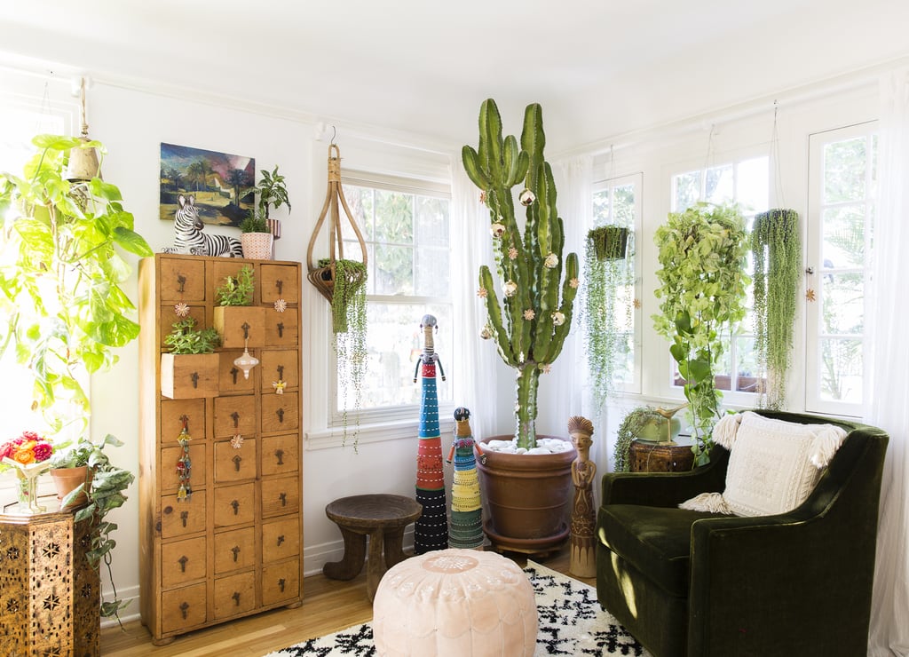 Justina's secret to small-space holiday decorating? Fill it up! "I think people often try and leave small spaces sparse so as not to be cluttered, but I think that filling the space with lots of color and pattern — bright wallpapers, fun window treatments, eclectic furnishings — just makes the space feel more cozy."