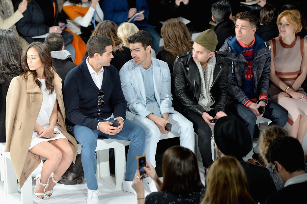 Joe sat next to Jesse Metcalfe at the Lacoste show on Saturday.