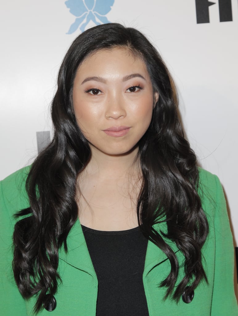 The texture and shine in Awkwafina's jet black hair gives her look serious edge and sex appeal.