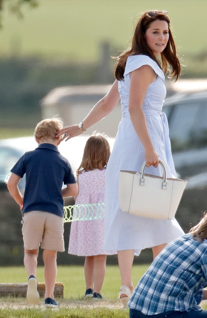 We know that look of Kate's. It says: "Please. Please let them be satisfied with this plaything for a while, otherwise this is going to be a long-ass day once they figure out this isn't Mary Poppins's purse."