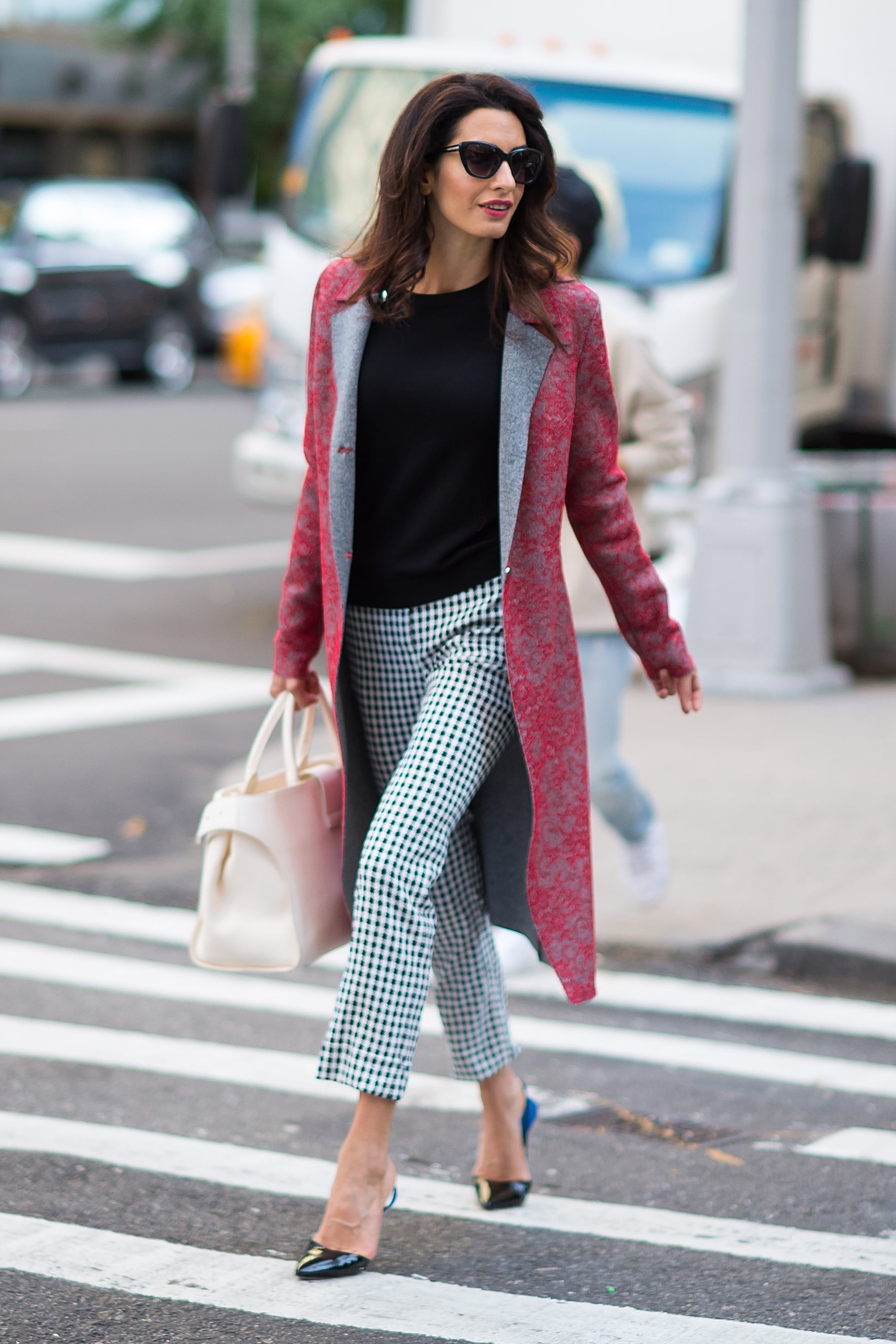 Amal Clooney Wore an Oversized Dior Bag With a Trench Coat