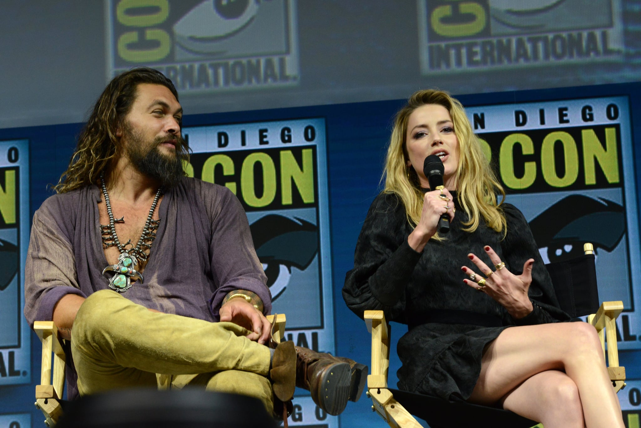 SAN DIEGO, CA - JULY 21:  Jason Momoa and Amber Heard speak onstage at the Warner Bros. 'Aquaman' theatrical panel during Comic-Con International 2018 at San Diego Convention Centre on July 21, 2018 in San Diego, California.  (Photo by Albert L. Ortega/Getty Images)