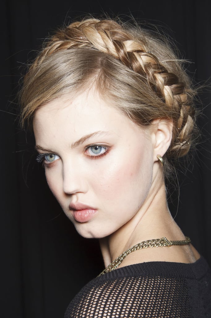 "The trick to parting your hair for milkmaid braids is to keep the part messy. I use the end of my comb to make a zigzag all the way to the back of the head." 
— Hairstylist Jeanie Syfu at Rebecca Minkoff (as modeled by Lindsey Wixson, pictured)