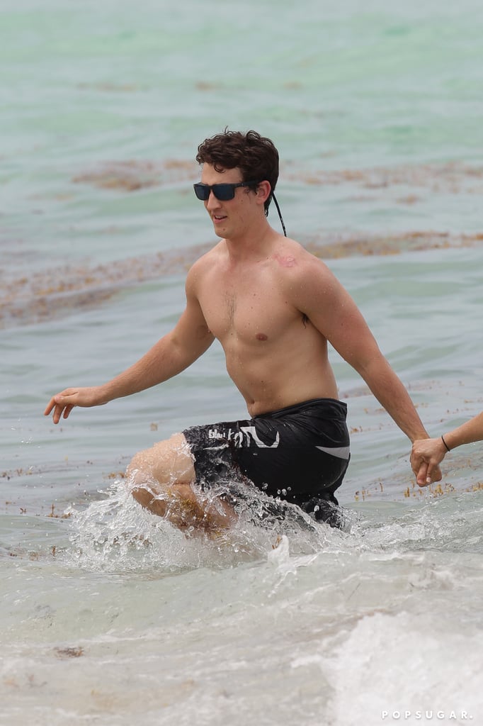 Miles Teller and His Girlfriend on the Beach in Miami