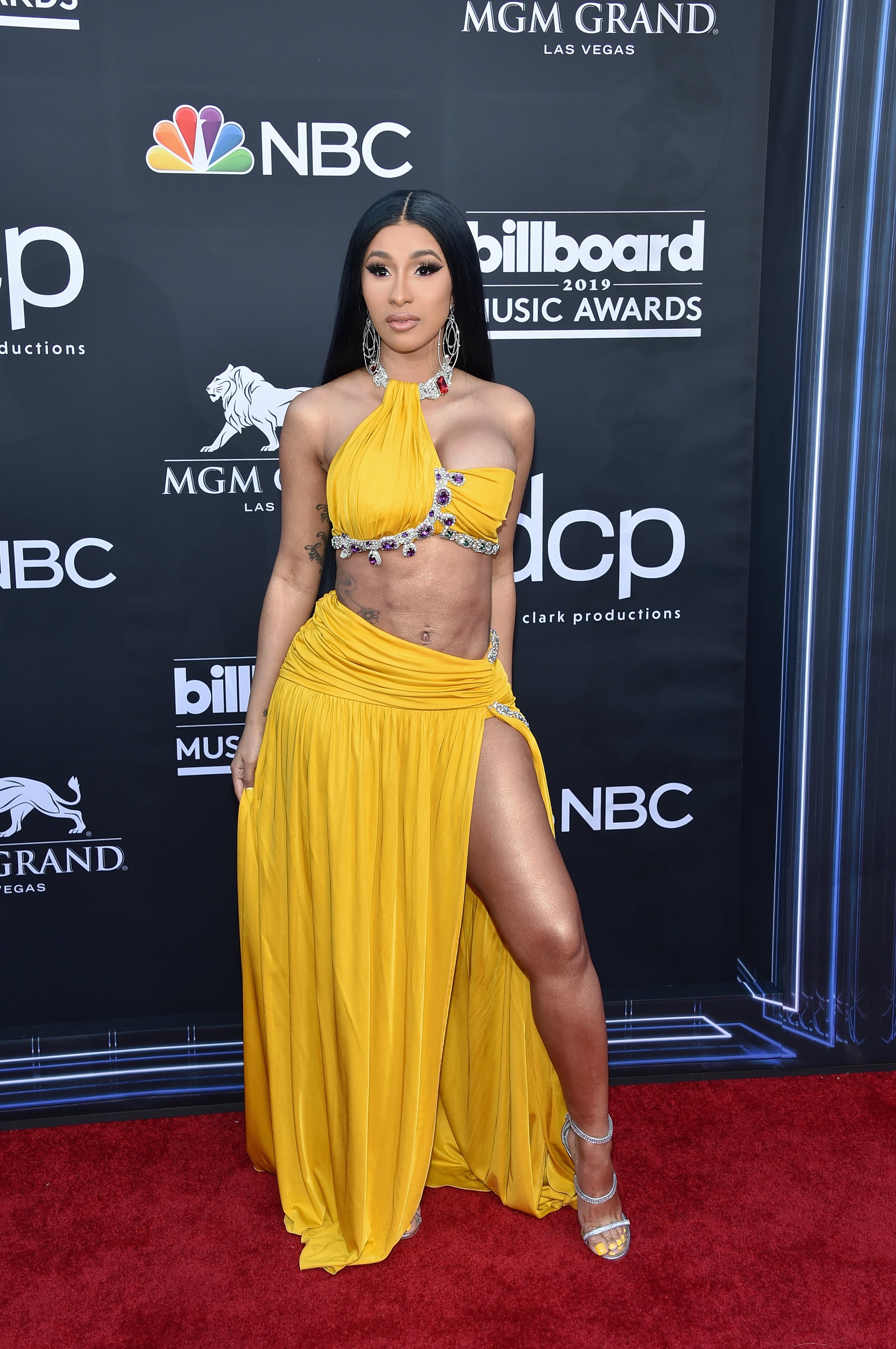 Cardi B's Louis Vuitton ponytail matches her crop top and skirt