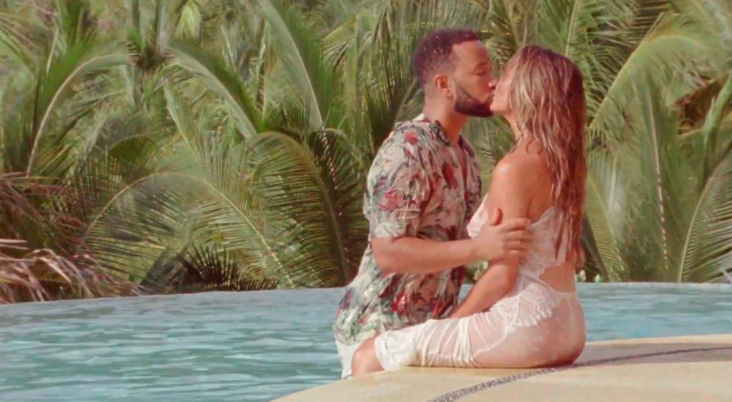 Chrissy Teigen Reveals Pregnancy in a White Dress in "Wild"