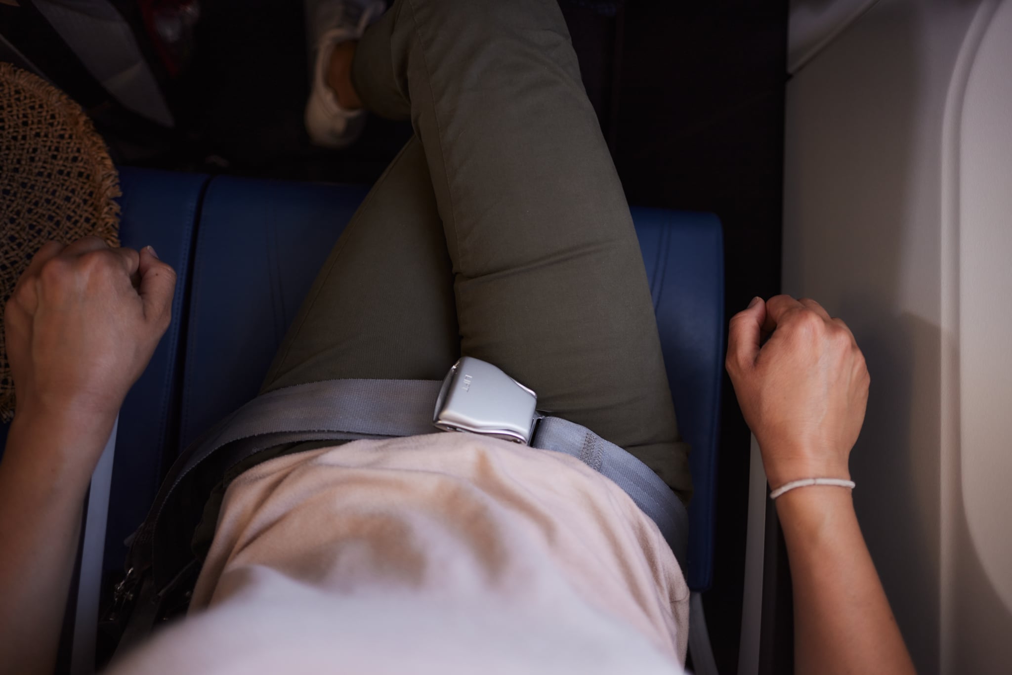 High Angle View of Woman Sitting in Airplane Seat