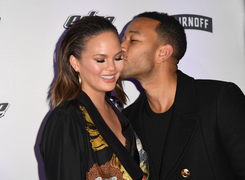 February: John Planted a Kiss on Chrissy's Cheek at a Sports Illustrated Event