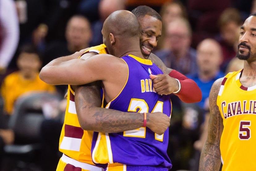 CLEVELAND, OH - FEBRUARY 10: LeBron James #23 of the Cleveland Cavaliers greets Kobe Bryant #24 of the Los Angeles Lakers during the first half at Quicken Loans Arena on February 10, 2016 in Cleveland, Ohio. NOTE TO USER: User expressly acknowledges and a
