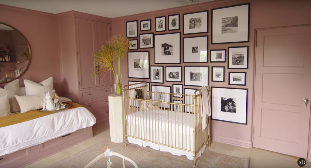 The gallery wall behind Atlas's crib is covered in superspecial black-and-white photos of family and friends.