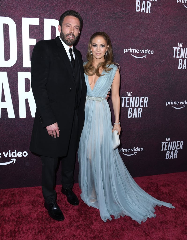 As is the case with most, if not all Bennifer  appearances, while we love to see the couple looking so gorgeous and in love, we're usually distracted by whatever incredible look Jennifer Lopez is wearing. Allow us to present the latest example: J Lo and Ben Affleck, who stars in The Tender Bar, attending the film's premiere in Los Angeles on Sunday evening. 
The triple-threat superstar posed in an ethereal icy blue gown on the red carpet, featuring a plunging neckline and sheer, airy fabric. The dress, from Elie Saab's fall/winter 2021 Couture collection, was also belted at the waist with a matching velvet bow. Styled by Rob Zangardi and Mariel Haenn, she also accessorized with diamond earrings, a bracelet, and clutch from Tyler Ellis. Ben, on the other hand, stood beside J Lo in a sleek black suit and coat. Ahead, get a close-up view of Jennifer's Cinderella-esque gown and enjoy more adorable photos of the happy couple.

    Related:

            
            
                                    
                            

            J Lo&apos;s "On My Way" Dress Is an Intricate Work of Art That Symbolizes Rebirth