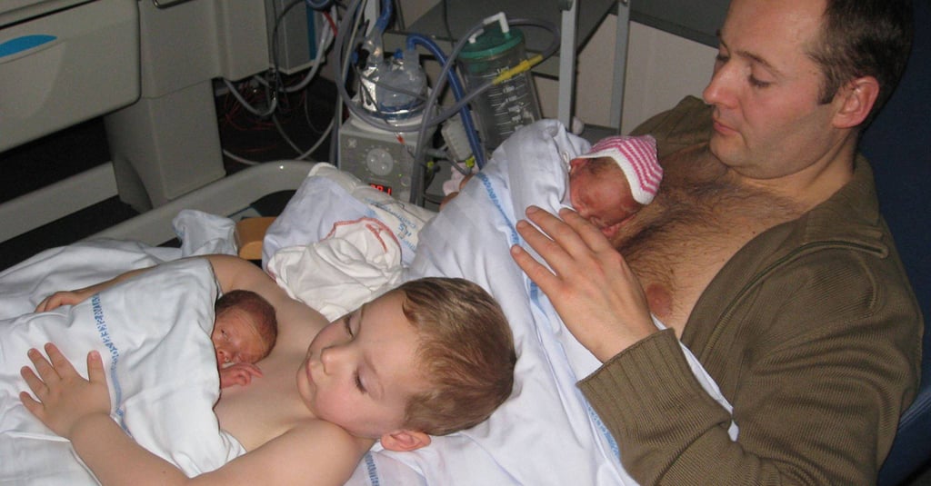 Father and Son Doing Skin-to-Skin Contact With Twins