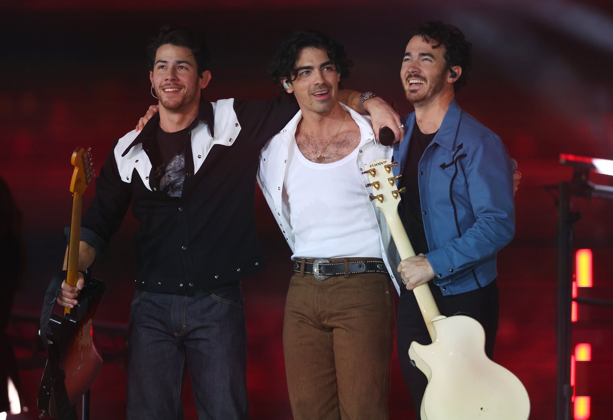 ARLINGTON, TEXAS - NOVEMBER 24: Nick Jonas, Joe Jonas, and Kevin Jonas of the Jonas Brothers perform in the halftime show during the game between the Dallas Cowboys and the New York Giants at AT&T Stadium on 24 November, 2022 in Arlington, Texas.  (Photo by Richard Rodriguez/Getty Images)