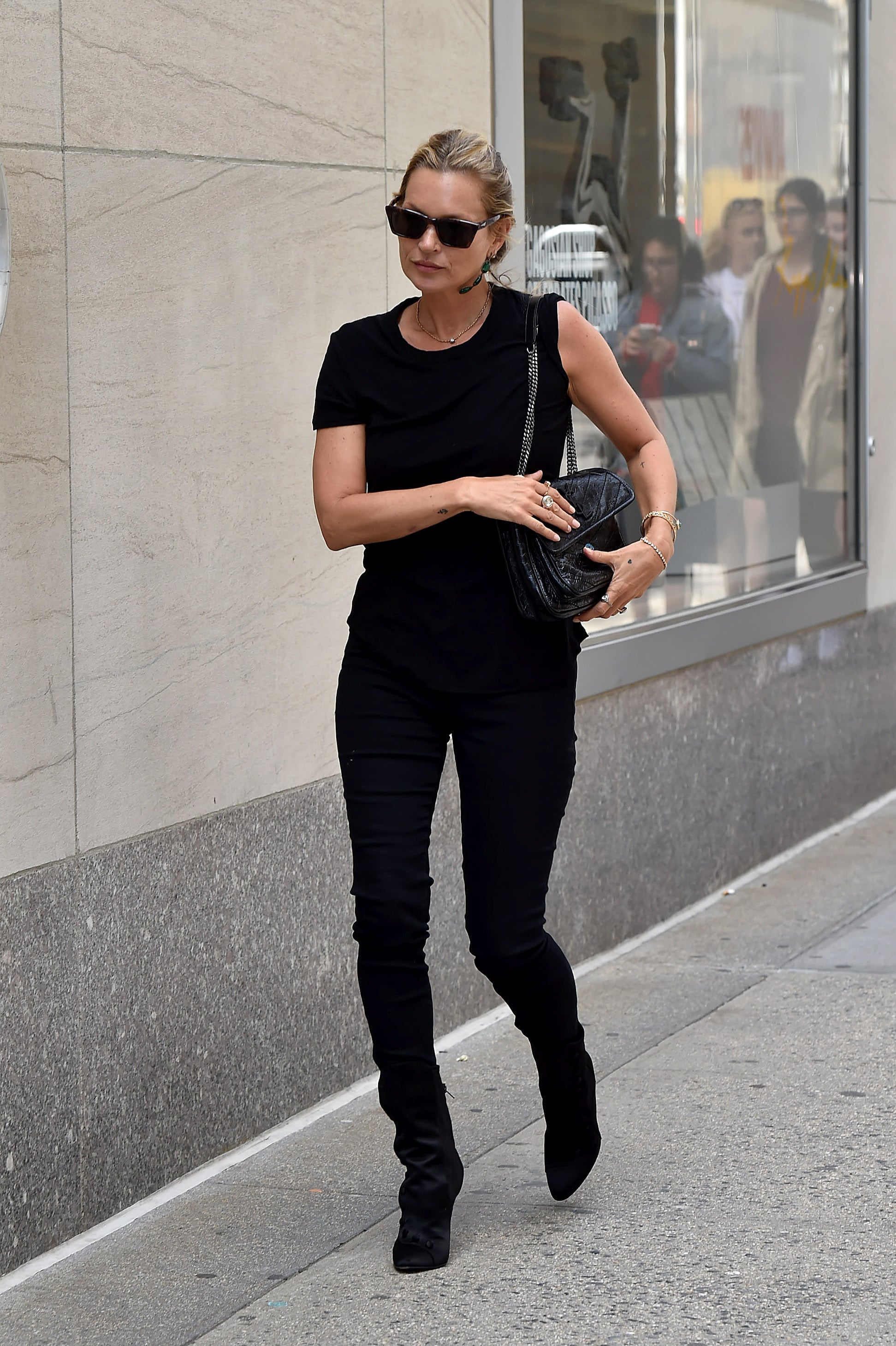 Moss is the definition of minimal and chic while strolling on Madison Avenue in New York City.