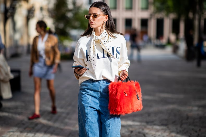 With an Oversize Sweatshirt, a Silk Twill Scarf, and a Faux-Fur Bag