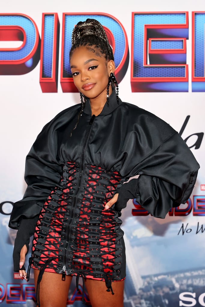 Marsai Martin deserves full credit for single-handedly curing my arachnophobia in her lace-up Dolce & Gabbana outfit at the Spider-Man: No Way Home world premiere. Wearing a look that beautifully complemented Zendaya's slinky spiderweb slip dress, Marsai stepped onto the red carpet looking like an honorary Spider-Girl, and we'd definitely cast her in the next Marvel film. The outfit featured an extra-high-waisted corset miniskirt in a subtle black-and-red leopard print that gave off major Far From Home Spidey suit vibes.
The skirt was layered over an oversized bomber jacket with puffed sleeves that covered Marsai's hands like gloves, and we're only a little bit suspicious that she had a secret superhero costume on underneath (just in case the world needs saving). Marsai added a few finishing touches to the outfit with a pair of Le Silla heels that read "punk" across the toes in a jagged comic-book font, a high braided ponytail, and a set of black drop earrings that were eerily reminiscent of tarantulas. So, yes, we're convinced that Marsai will be Spider-Girl someday. In the meantime, admire her gorgeous No Way Home premiere look here.

    Related:

            
            
                                    
                            

            Lori Harvey&apos;s Sheer Dress at the Miss Universe Pageant Deserves to Be Worn With a Crown