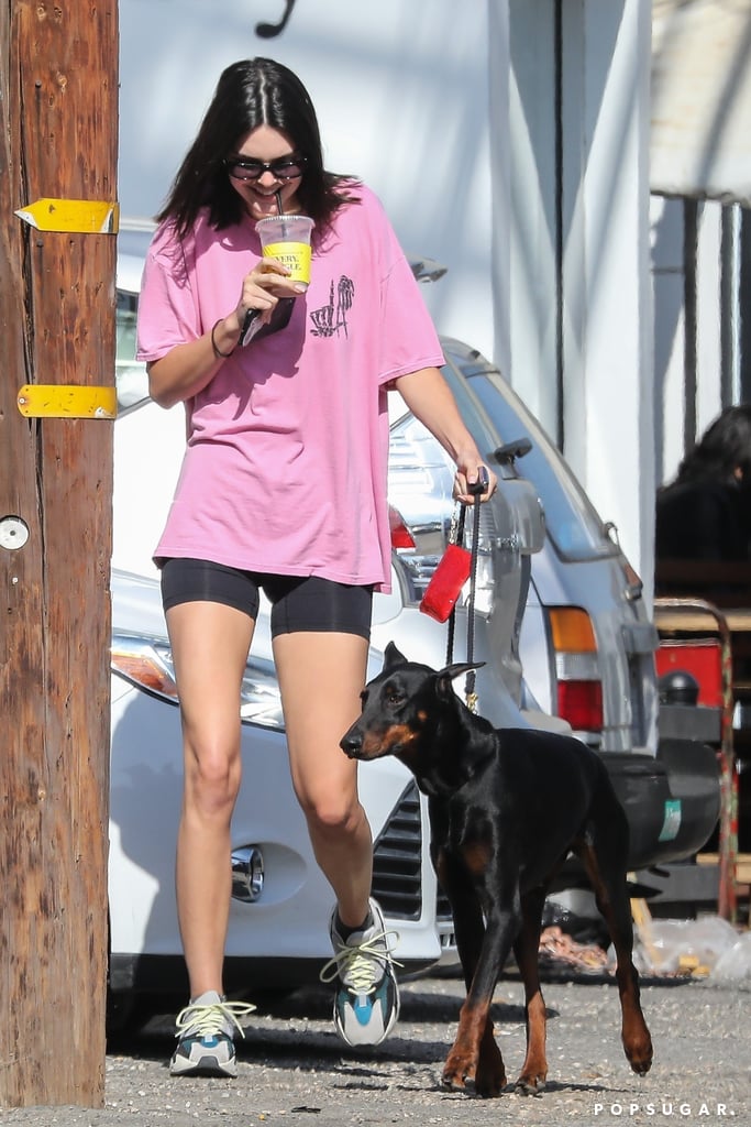 Kendall had a super casual moment in Prix Workshop biker shorts and her Adidas Wave Runner trainers. She stood out on the streets of West Hollywood in an oversize pink Adaption tee.