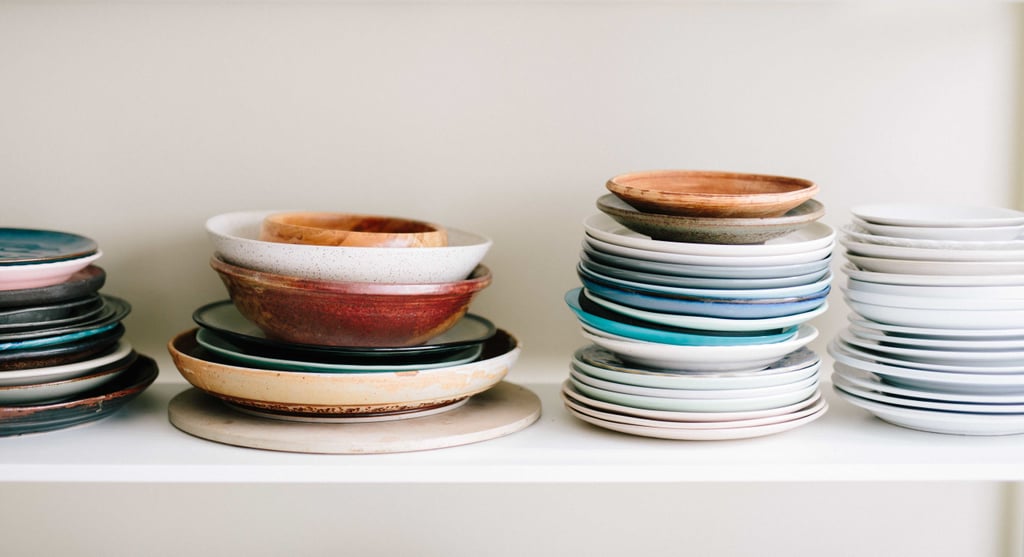 Random mismatched flatware, plates, and glasses