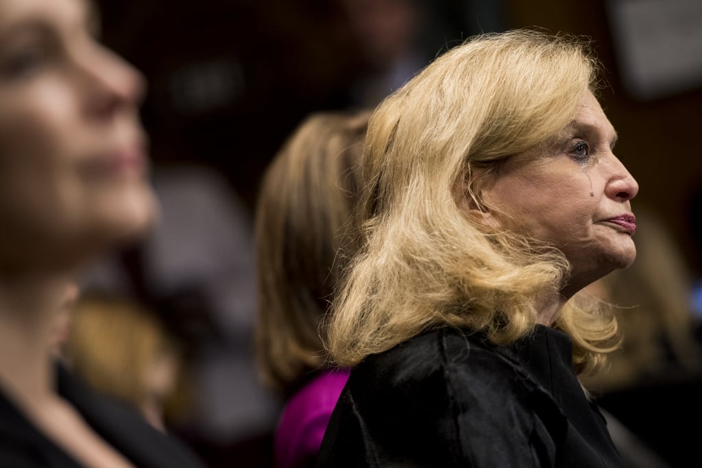 Representative Carolyn Maloney of New York cries during Ford's testimony.