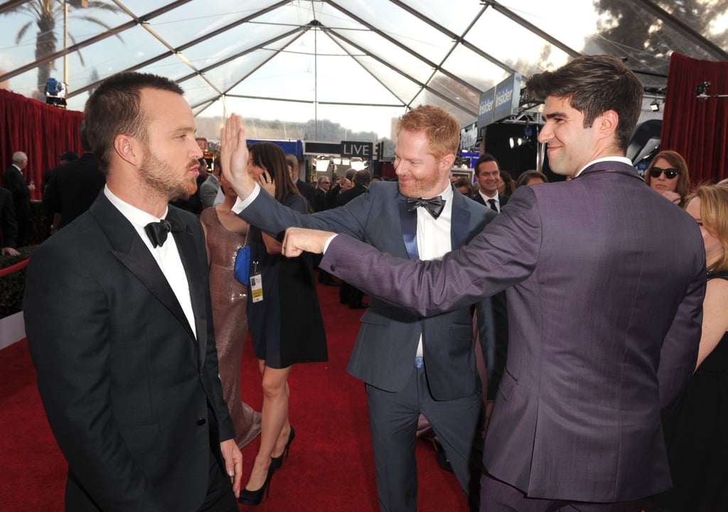 Aaron Paul got attention from Jesse Tyler Ferguson and his husband, Justin Mikita.