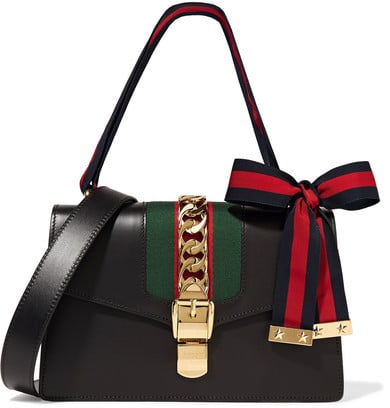 The ultimate in ladylike bags just might be Gucci's Sylvie medium chain-embellished leather satchel ($2,490).