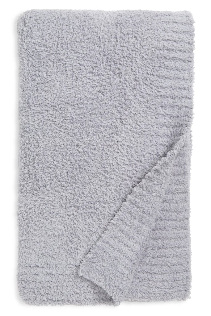 Barefoot Dreams CozyChic Throw Blanket ($100, originally $158)
As a Taurus, I take my lounging very seriously. So trust me when I say there is nothing that sets a cozy mood more than this Barefoot Dreams blanket. The texture is soft without being slippery and serves as the ideal medium weight. Use it as a throw blanket on your couch for movie nights or keep it at the foot of your bed for an extra layer.
