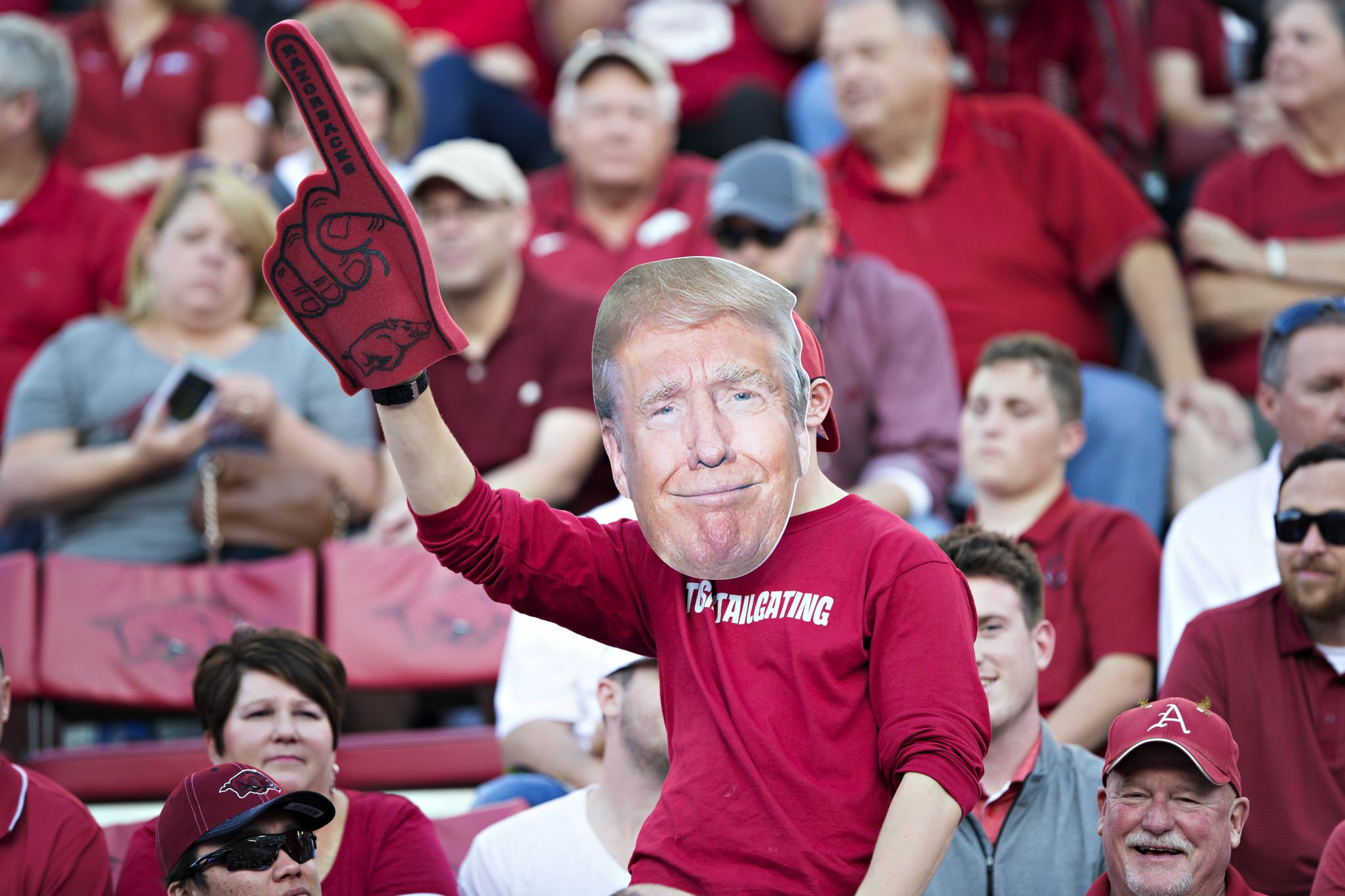 Fan of the Arkansas Razorbacks with his Donald Trump face on during a game against the Mississippi Rebels at Razorback Stadium on October 15, 2016 in Fayetteville, Arkansas.