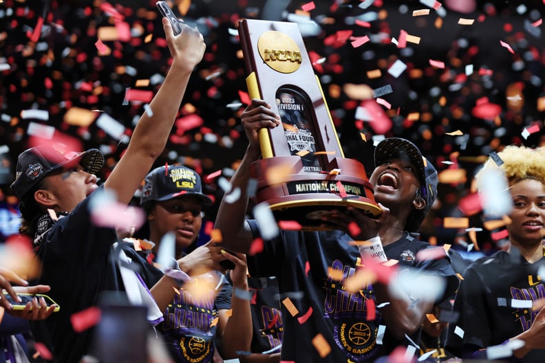DALLAS, TEXAS - APRIL 02: LSU Lady Tigers players hold up the championship trophy after defeating the Iowa Hawkeyes 102-85 during the 2023 NCAA Women's Basketball Tournament championship game at American Airlines Center on April 02, 2023 in Dallas, Texas.
