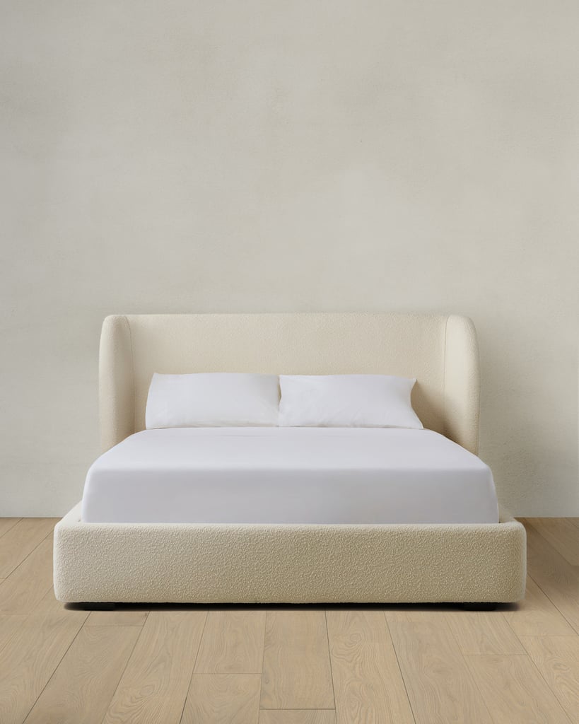 Quince Performance Boucle Shelter Bed ($1,200)
Why do they call it a shelter bed? Well, because it actually gives you shelter. The sculptural headboard wraps around you, creating a cozy, protected feel. Its padded frame and textured fabric make it a true standout. And bonus: the frame is cushioned, so if you wake up in a tizzy, there's no need to worry about any accidental bumps to the head.