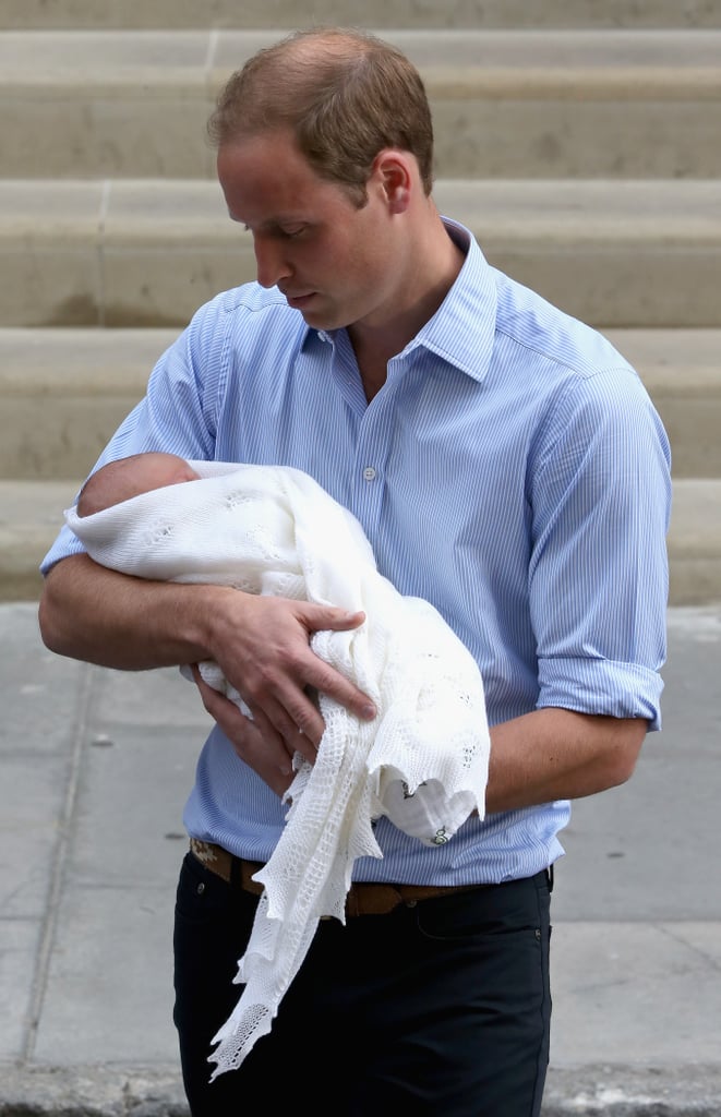 It was love at first sight for William holding newborn George in 2013.