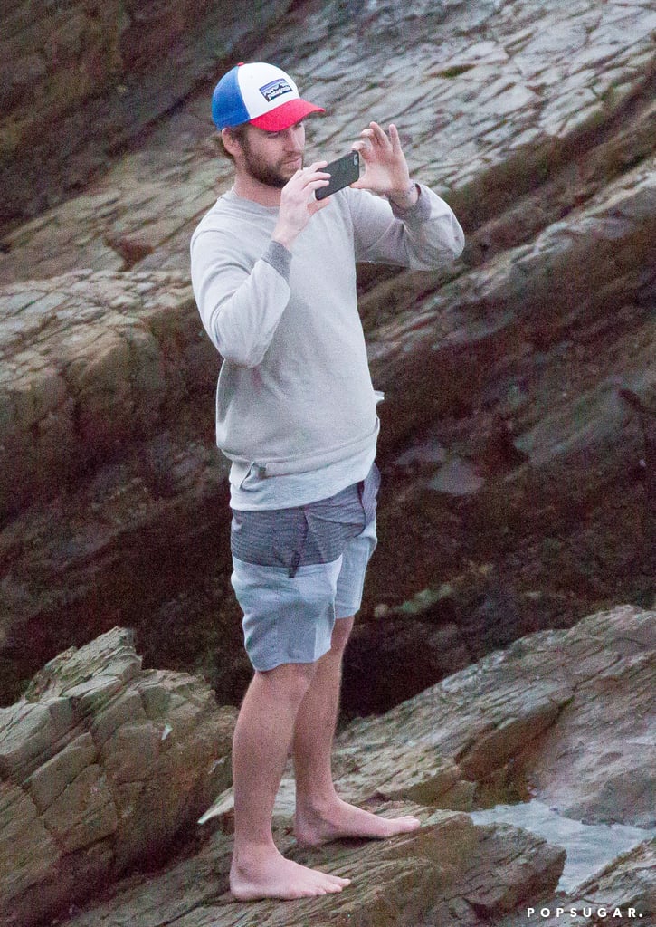 Liam Hemsworth Taking Pictures of Chris Surfing in Australia